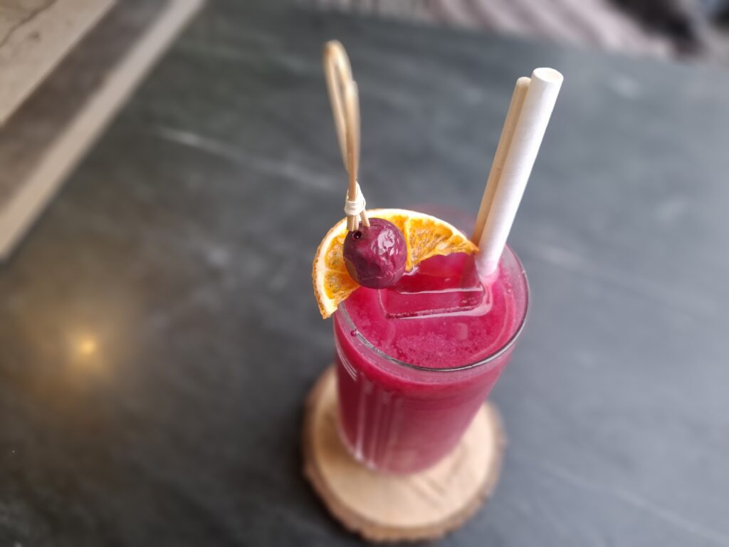 Red-coloured Indie Berry gin and jamun cocktail served at Miroh in Jaipur.
